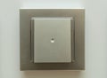 Silver electrical light switch on a wall Royalty Free Stock Photo