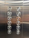 A silver elevator with a red circle on the number 4 Royalty Free Stock Photo