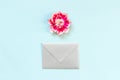 Silver envelope and head tulip on blue background. Sprin