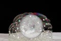 silver ether crypto currency behind many soap bubbles