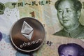 Silver Ethereum Coin on Chinese Yuan banknote Royalty Free Stock Photo