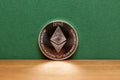 Silver ethereum coin green background