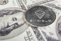 Silver Ethereum on hundred dollars bills. Close-up, macro shot.