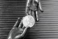 Silver euro coins in futuristic robot hands