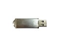 Silver flash drive close-up on a white isolated background. A USB flash drive is a storage device that uses flash memory as a stor