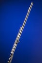 Silver Flute Isolated On Blue Royalty Free Stock Photo