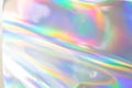 the silver foil surface reflecting the colorful rainbow holographic background. Royalty Free Stock Photo