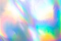 the silver foil surface reflecting the colorful rainbow holographic background. Royalty Free Stock Photo