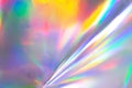 the silver foil surface reflecting the colorful rainbow holographic background. Royalty Free Stock Photo