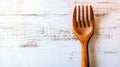 A silver fork with intricate details is set against a plain white backdrop, ideal for culinary applications Royalty Free Stock Photo