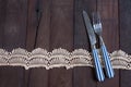 Silver fork,and knife tied and chintz and lace ribbon with copy Royalty Free Stock Photo