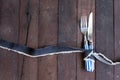 Silver fork,and knife tied and Denim ribbon with copy space. Royalty Free Stock Photo