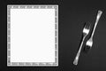 Silver forks and empty menu on background, flat lay. Space for text Royalty Free Stock Photo