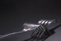 Silver forks entwined Royalty Free Stock Photo