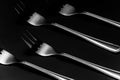 Silver Forks in Row on Dark Background. Low Kay Noir Image. Still Life Pattern Background Royalty Free Stock Photo