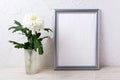 Silver frame mockup with white chrysanthemum in glass vase Royalty Free Stock Photo