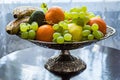 Silver fruit bowl by the window. Royalty Free Stock Photo