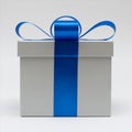 Silver gift box with blue satin bow ribbon on white background Royalty Free Stock Photo