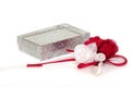 Silver gift box with organdy red and white roses on white. Royalty Free Stock Photo