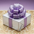 Silver gift box with purple bow Royalty Free Stock Photo
