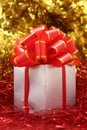 Silver gift wrapped present with red bow Royalty Free Stock Photo