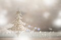 Silver glitter Christmas tree on grey background with lights bokeh, copy space. Greeting card for new year party. Festive holiday Royalty Free Stock Photo