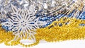 Silver Glitter Snowflake with Gold and Blue Beads in Festive Holiday Arrangement Royalty Free Stock Photo