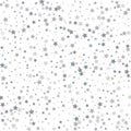 Silver glitter stars falling from the sky on white background. A Royalty Free Stock Photo