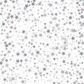 Silver glitter stars falling from the sky on white background. A Royalty Free Stock Photo