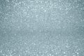 Silver glitter texture background with blur light effect and shiny sparkling particles. Glittering silver or shining snow light fo