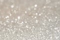 Silver glittering christmas lights. Blurred abstract holiday background Royalty Free Stock Photo