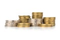 silver and glod coin stack. town. pile. on white backgr Royalty Free Stock Photo
