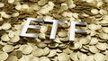 Silver glossy ETF text on pile of golden bitcoins. Concept of authorities approve Exchange Traded Fund