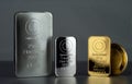 Silver and gold bars and coin on a dark Royalty Free Stock Photo