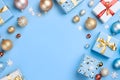 Silver and gold baubles and snowflakes, gifts with bows on blue background. Top view.Christmas bright background, banner with Royalty Free Stock Photo