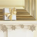 Silver and gold Christmas gift present on mantel with glitter snowflake garland. Beautiful, elegant, fancy holiday home interior