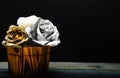 Silver and gold fresh rose flower in wooden vase. grunge beauty. luxury and success. metallized antique decor. richness Royalty Free Stock Photo