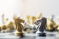 Silver and gold horse chess on board