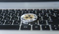 Silver gold ripple coin on a laptop keyboard closeup. Blockchain mining. Digital money and virtual cryptocurrency Royalty Free Stock Photo