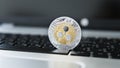 Silver gold ripple coin on a laptop keyboard closeup. Blockchain mining. Digital money and virtual cryptocurrency Royalty Free Stock Photo