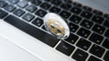 Silver gold ripple coin on a laptop keyboard closeup. Blockchain mining. Digital money and virtual cryptocurrency Royalty Free Stock Photo