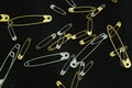 Silver and Gold safety pins Royalty Free Stock Photo