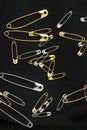 Silver and Gold safety pins Royalty Free Stock Photo