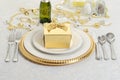 Silver and gold table setting with present Royalty Free Stock Photo