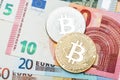 Silver and golden Bitcoin close-up. Euro currency as a backgroun Royalty Free Stock Photo