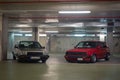 silver gray Volkswagen Santana GX5 parked next to a red Volkswagen Golf Mk2 GTI