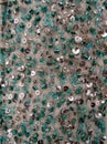 Silver and green blue glass seed beads and sequined mesh fabric texture Royalty Free Stock Photo