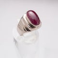 Silver handmade ring with a big maroon precious stone Royalty Free Stock Photo