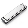 Silver harmonica on white background Royalty Free Stock Photo