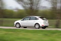 Silver hatchback car in motion blur Royalty Free Stock Photo